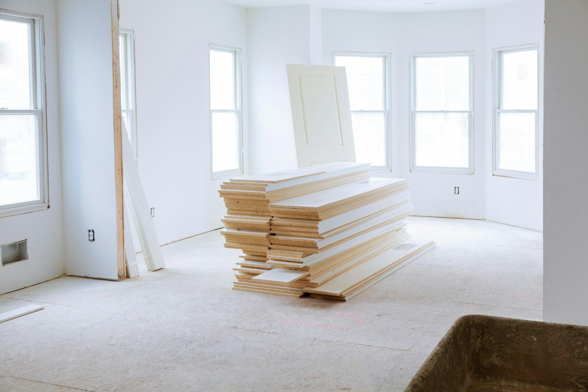 unfinished room of inside house under construction drywall tape